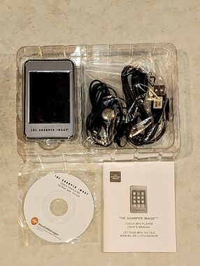 Sharper Image Portable Touch MP4 Player in Black and Silver